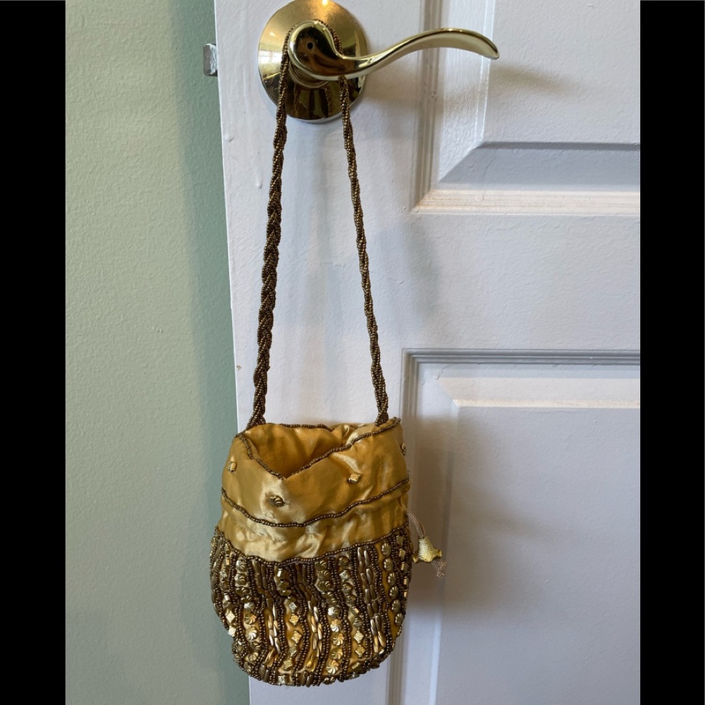 Gold color satin with decorative work.